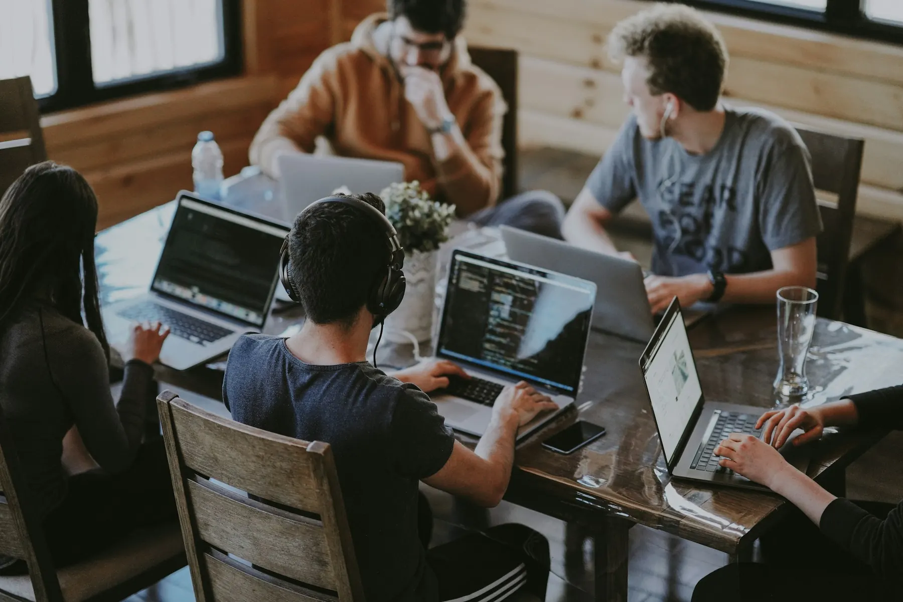 Helixios engineers collaborating around a table